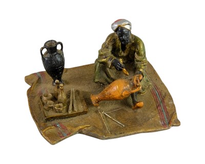 Lot 3 - A cold painted bronze figure of an Arab trader.