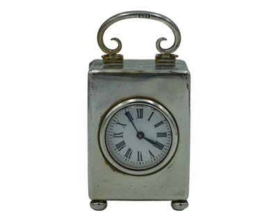 Lot 289 - A silver carriage clock by William Comyns & Sons Ltd.