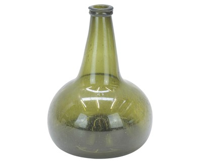 Lot 742 - An early 18th century green glass onion bottle.