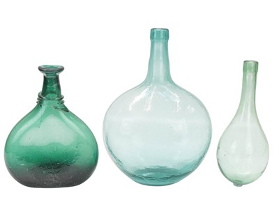 Lot 708 - Three green glass bottles.