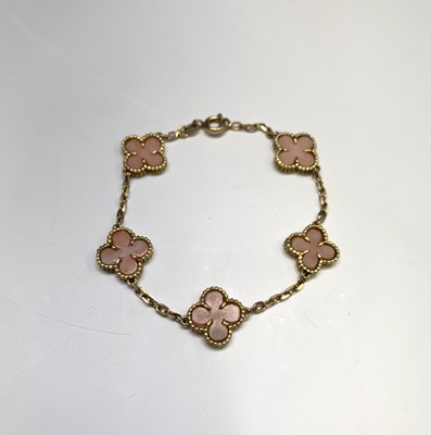 Lot 2348 - An 18ct gold and pink coral bracelet with...