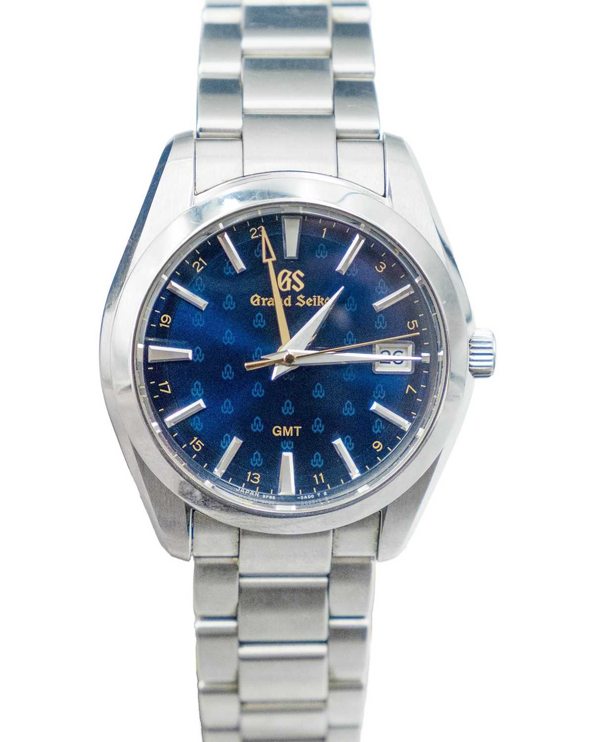 Lot 636 - GRAND SEIKO - A Heritage GMT Quartz Watch 50th Anniversary stainless steel gentleman's bracelet wristwatch.
