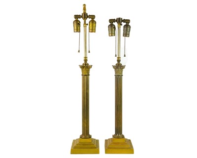 Lot 746 - A pair of heavy brass table lamps of Corinthian column form.