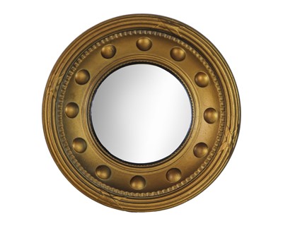Lot 749 - A gilt framed convex wall mirror.