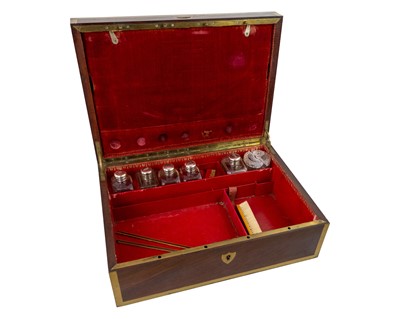 Lot 288 - A remarkable 19th-century French mahogany toilet case with silver mounted accessories.
