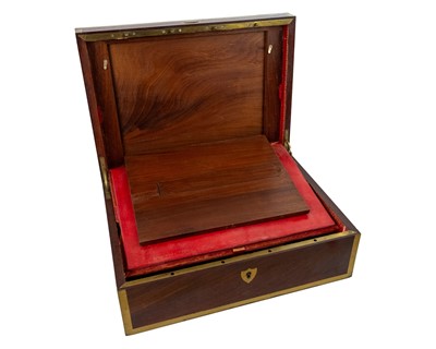 Lot 288 - A remarkable 19th-century French mahogany toilet case with silver mounted accessories.