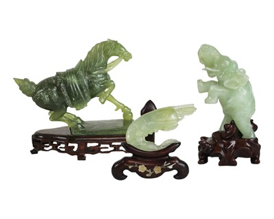 Lot 332 - A Chinese jade type greenstone figure of a horse.