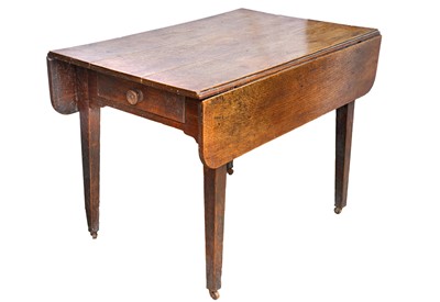 Lot 701 - A Victorian rustic oak drop leaf dining table.