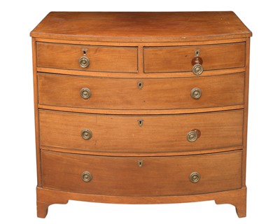 Lot 797 - An early 19th century mahogany and strung bow front chest.