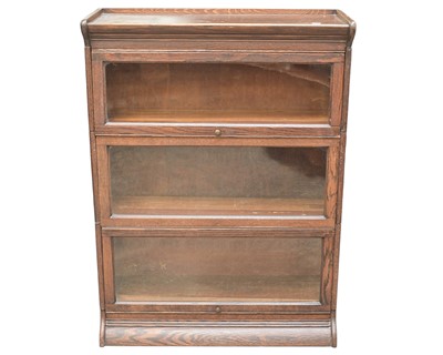 Lot 896 - An oak Globe Wernicke type three section glazed oak bookcase.
