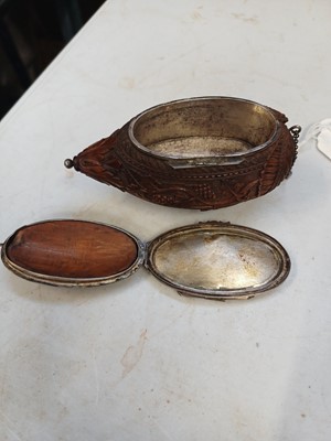 Lot 741 - A charming coquilla nut bugbear snuff box.