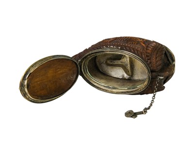 Lot 741 - A charming coquilla nut bugbear snuff box.