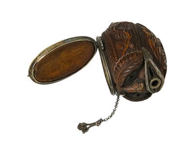 Lot 741 - A charming coquilla nut bugbear snuff box.