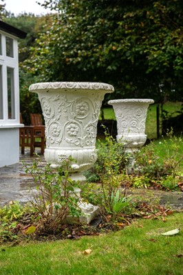 Lot 428 - A pair of reconstituted stone garden urns.