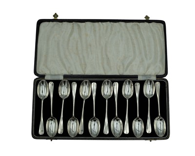 Lot 244 - A set of twelve silver Hanoverian pattern teaspoons by Josiah Williams & Co.