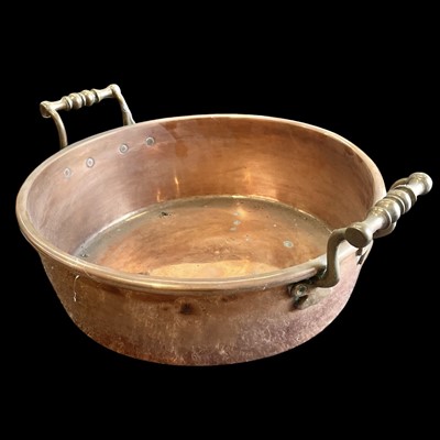 Lot 59 - A heavy copper jam pan, 32cm in diameter.