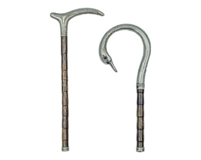Lot 172 - Two silver-mounted parasol handles.