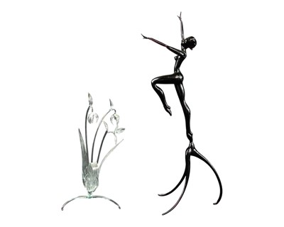 Lot 283 - An amethyst glass figure of a dancing female nude.