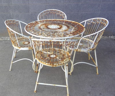 Lot 34 - A Metal Patio Set. The Table is 77cm tall by...