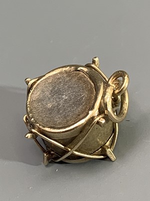 Lot 2416 - A 9ct gold drum charm