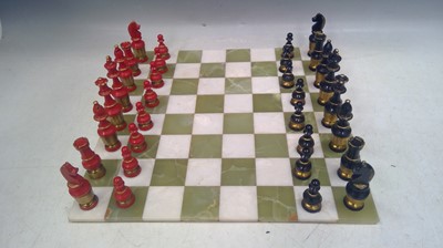 Lot 127 - A Brass and Wood Chess Set on an Agate Board....