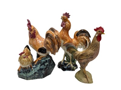 Lot 130 - Three pottery figures of chickens, the tallest...