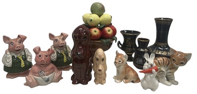 Lot 133 - Ceramics - Three Wade NatWest piggy banks, a...