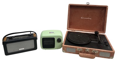 Lot 145 - A Crosley 'Cruiser Plus' peach velvet portable...