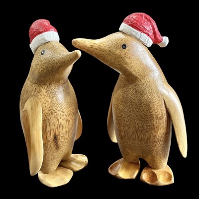 Lot 152 - Two wooden Christmas penguins, 26cm tall.