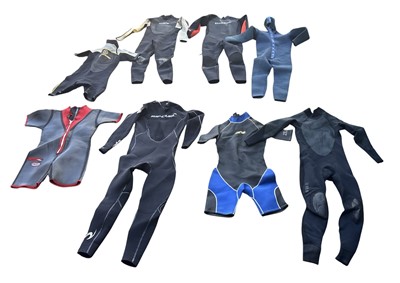 Lot 163 - Eight wetsuits, in various sizes.