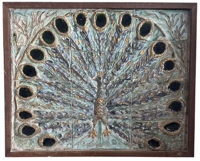 Lot 184 - A heavy and decorative ceramic peacock design...