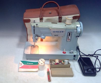 Lot 235 - A Vintage Singer Sewing Machine. The Machine...