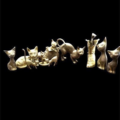 Lot 240 - A selection of brass cats, the largest is 13cm...