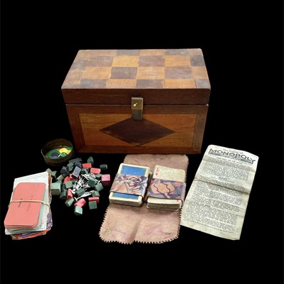 Lot 83 - A wooden box containing vintage playing cards,...