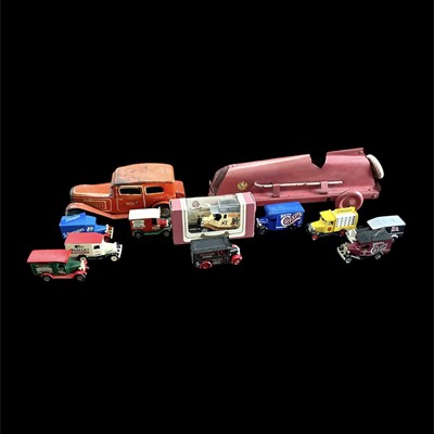 Lot 89 - Two vintage wind-up tinplate cars, the larger...