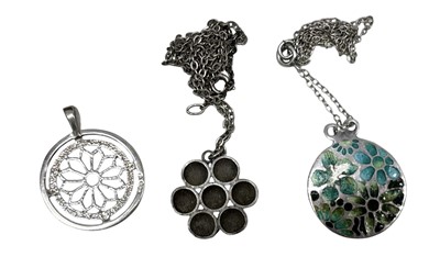 Lot 34 - A sterling silver rose window pendant along...