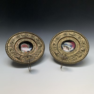 Lot 319 - A pair of Continental porcelain and brass...