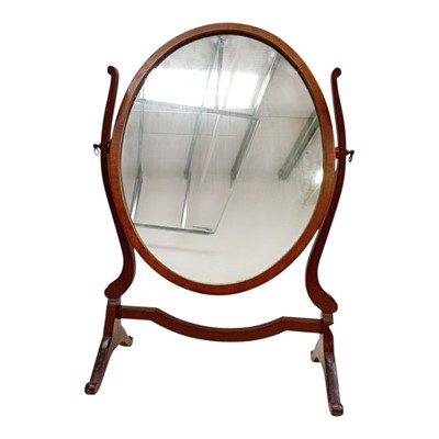 Lot 39 - An antique oval mahogany dressing table mirror....
