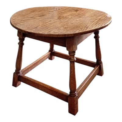 Lot 114 - An Oak coffee table. 65cm across x 50cm high.