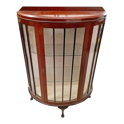 Lot 126 - An antique mahogany bow-front display cabinet....