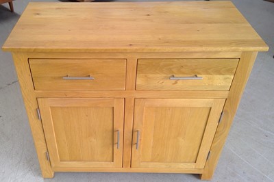Lot 129 - A Blonde Oak Cupboard. 85cm tall, 98cm wide...