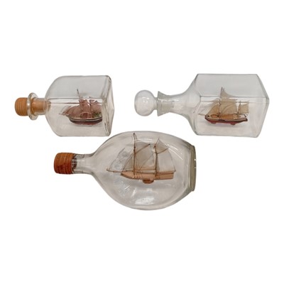Lot 128 - Three handcrafted ships in bottles by Mike...