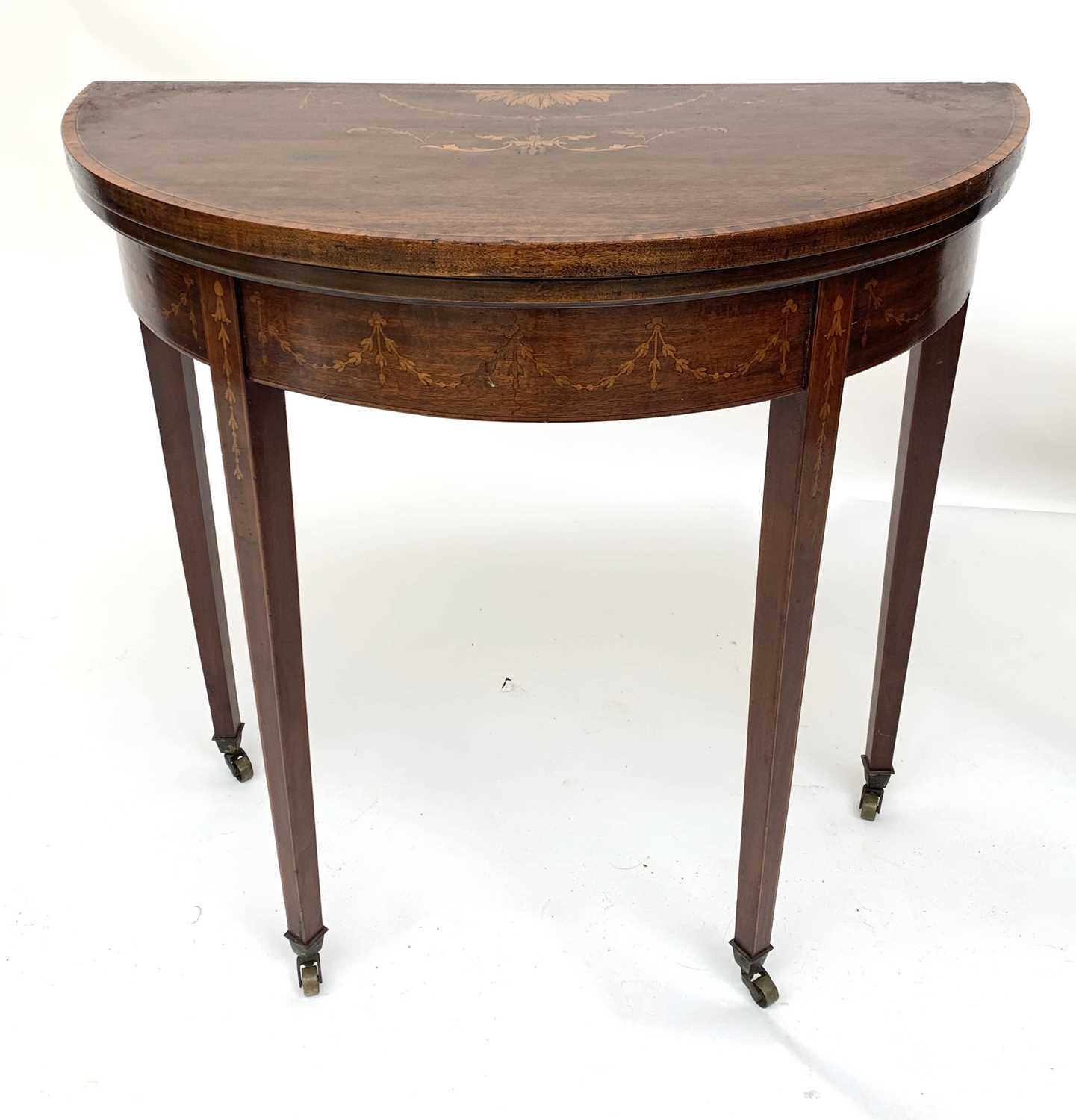 Lot 3142 - An Edwardian mahogany demi-lune card table,