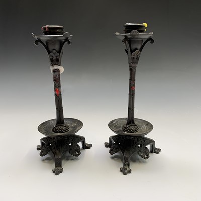 Lot 304 - A pair of bronze candlesticks, early 20th...