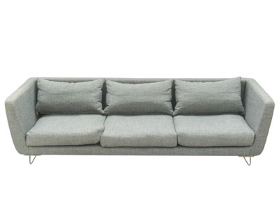Lot 249 - A grey fabric upholstered generous three seater sofa.