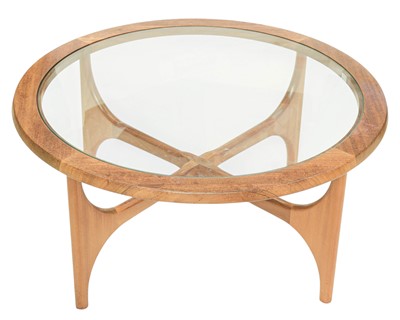 Lot 349 - A Stonehill glass top teak circular coffee table.