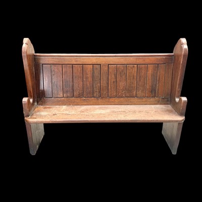 Lot 42 - A pine church pew, 142cm wide, 43cm to the...
