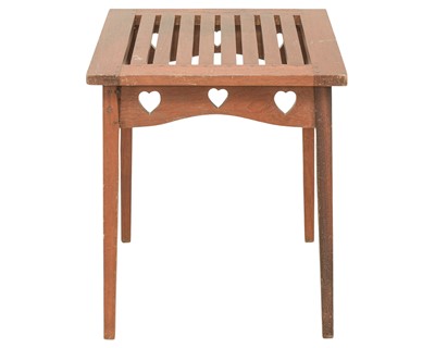Lot 219 - An Arts and Crafts style teak garden table.