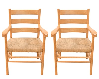 Lot 160 - A pair of mid-century beech elbow chairs.