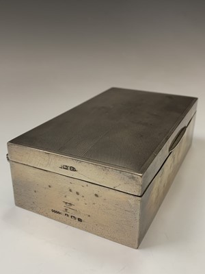 Lot 82 - An engine-turned silver cigarette box